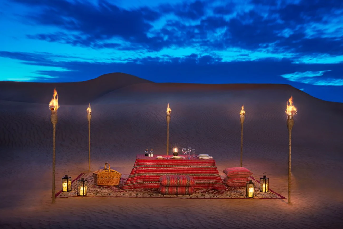 Private desert camp seating at twilight