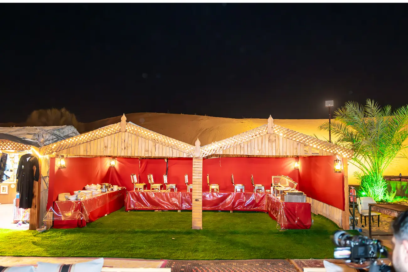 Private seating beneath a desert camp tent