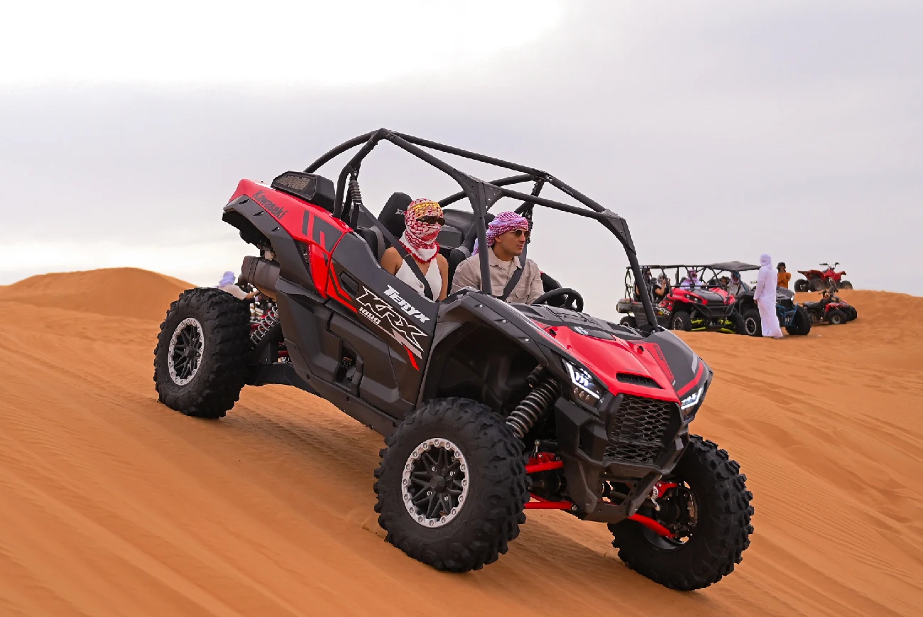Red dune buggy on the Dubai desert dunes